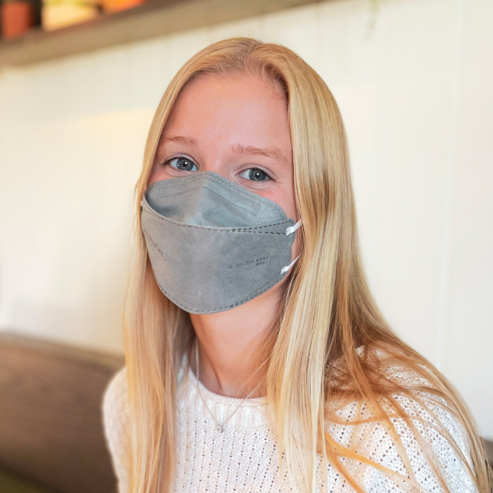 USA Teen Young Woman wearing small grey breatheTeq KN95 gray respirator face mask from Canada