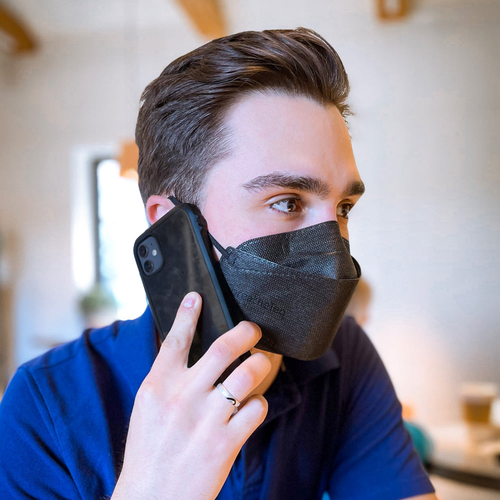 Business man at the office wearing black KN95 face mask USA shipping breatheTeq